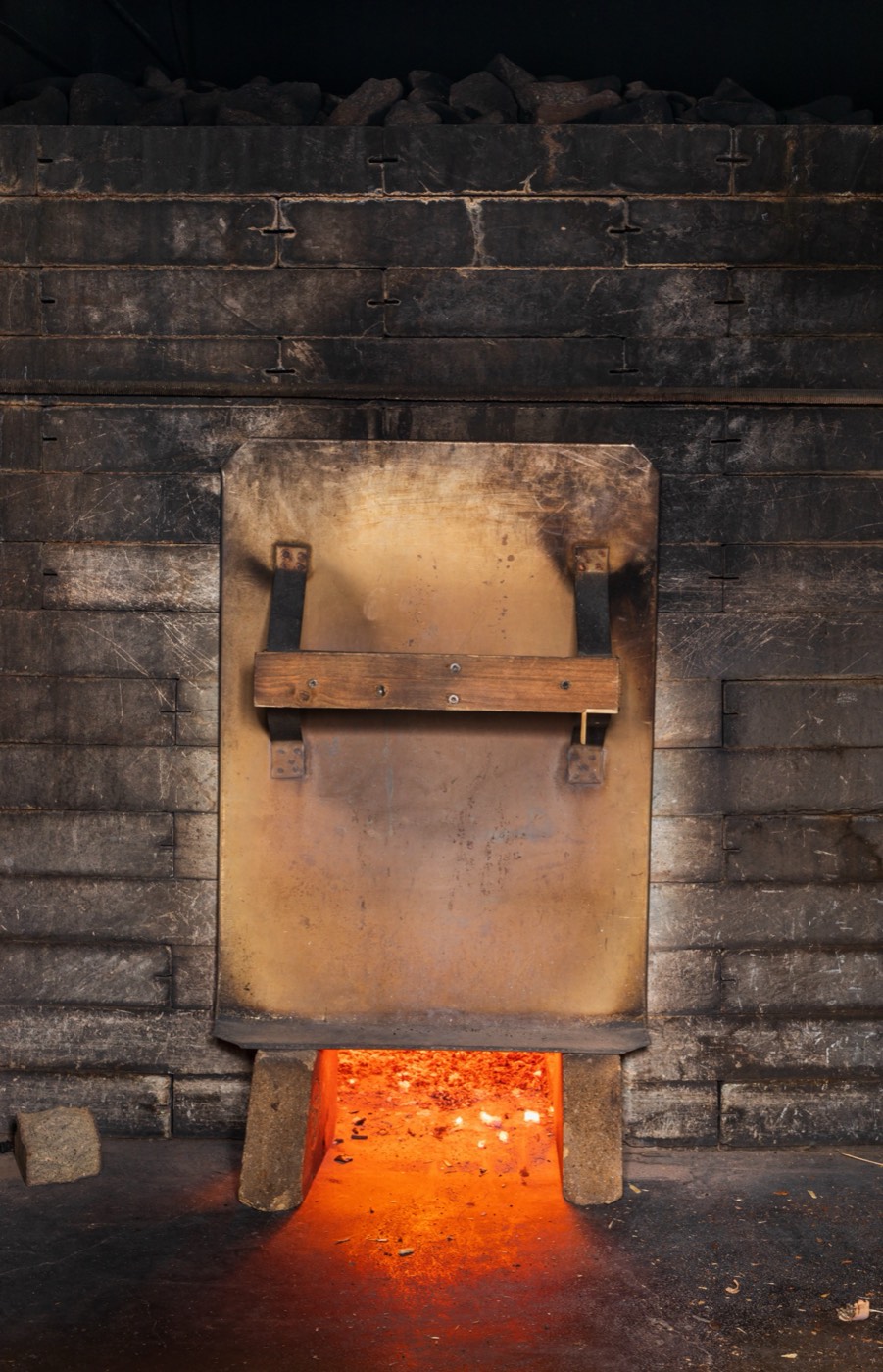 Smoke sauna stove with glowing embers